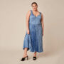 Woman wearing plus size wedding guest dress