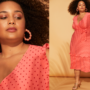 Woman wearing red and pink plus-size faux wrap dress.